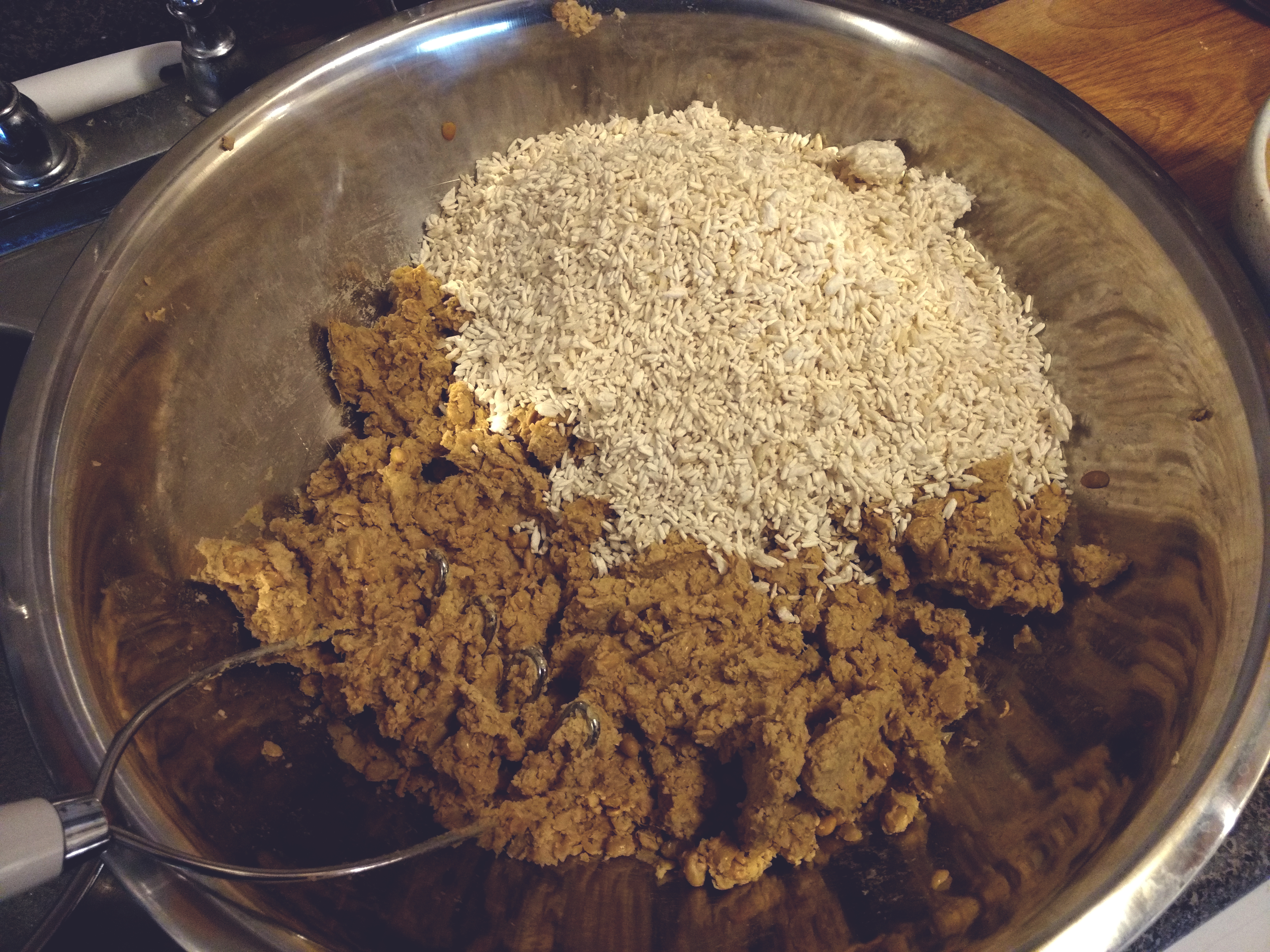 mashed soybeans and a pile of koji sitting unmixed in a bowl