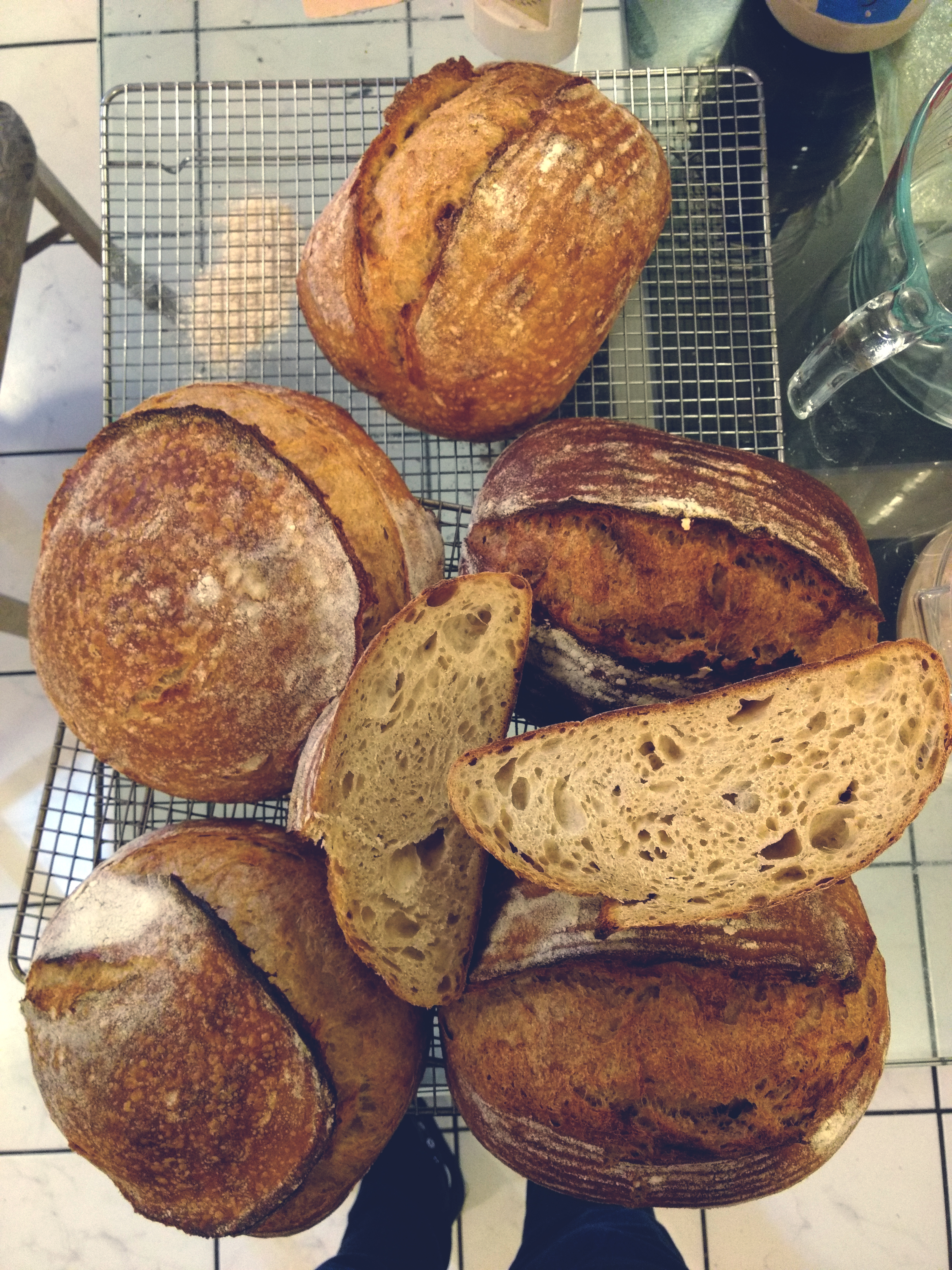 a picture of a pile of loaves of sourdough bread